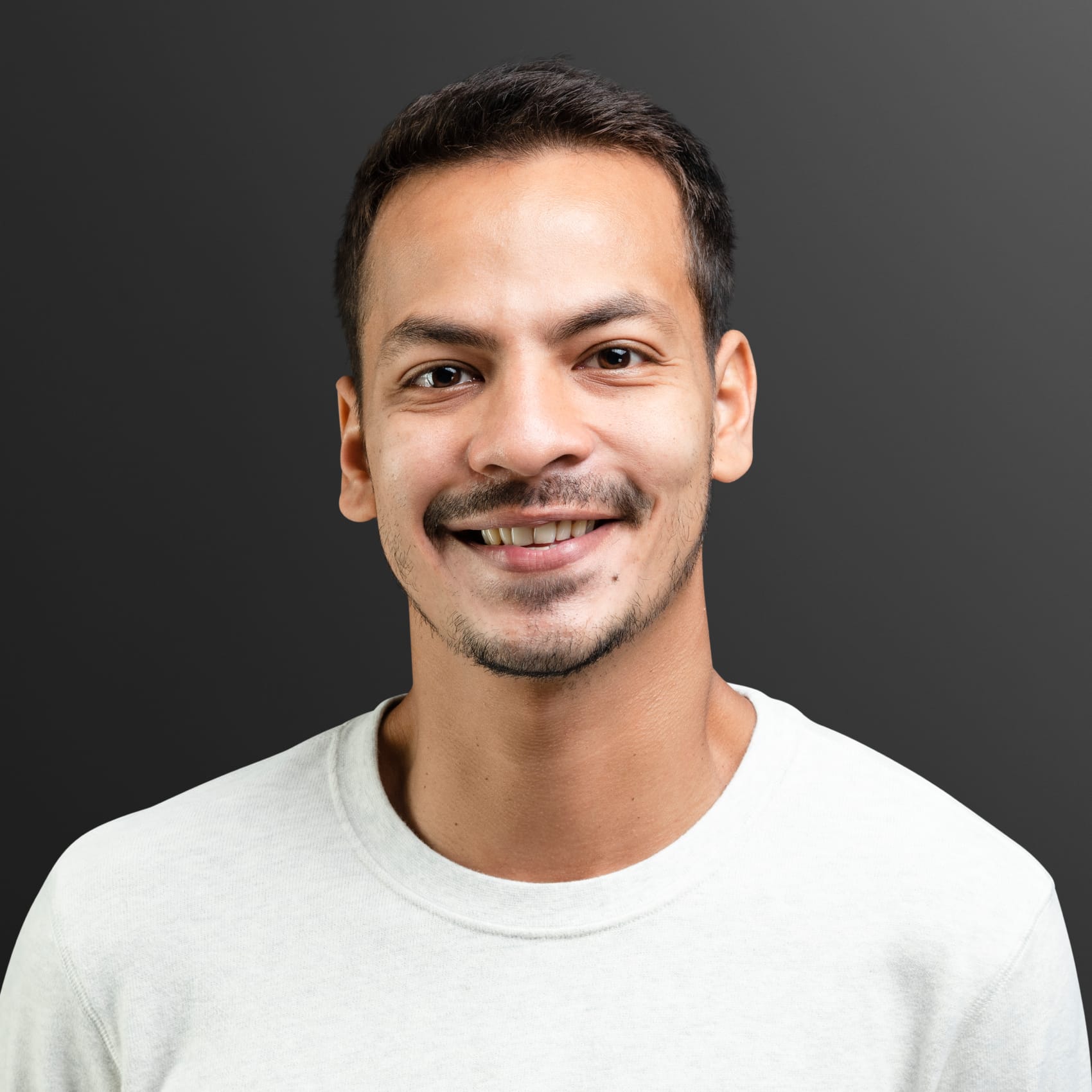 smiling man in white long sleeve tee portrait